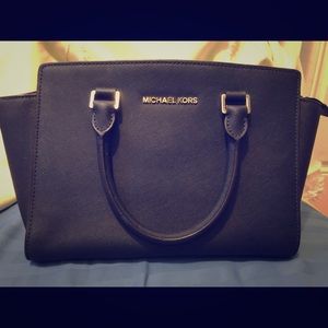 Navy blue saffiano leather Michael Kors bag.